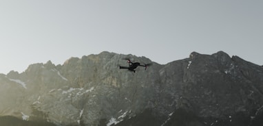 flaying black quad-copter drone