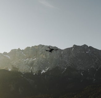 flaying black quad-copter drone