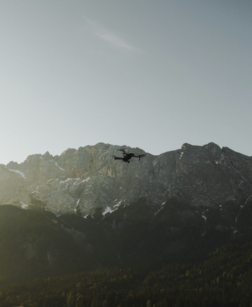 flaying black quad-copter drone