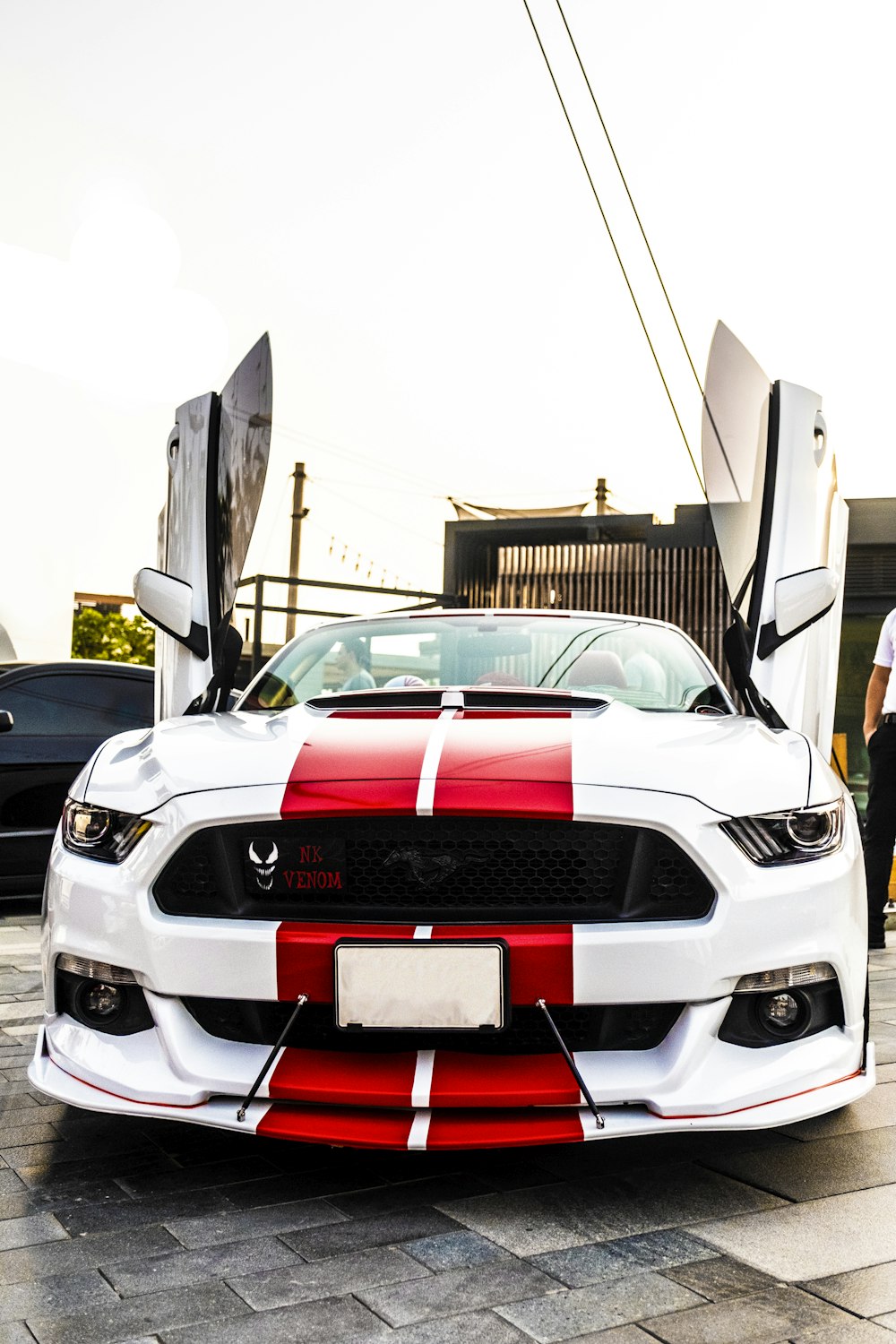 white and red Ford Mustang