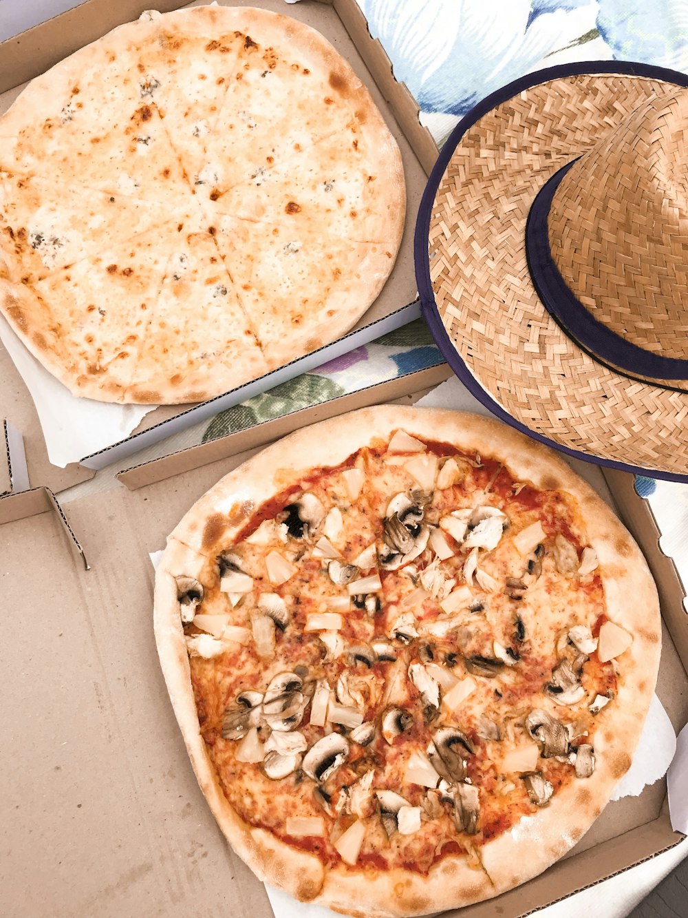 two cheese and mushroom pizza on box