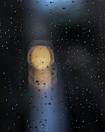 a blurry photo of rain drops on a window