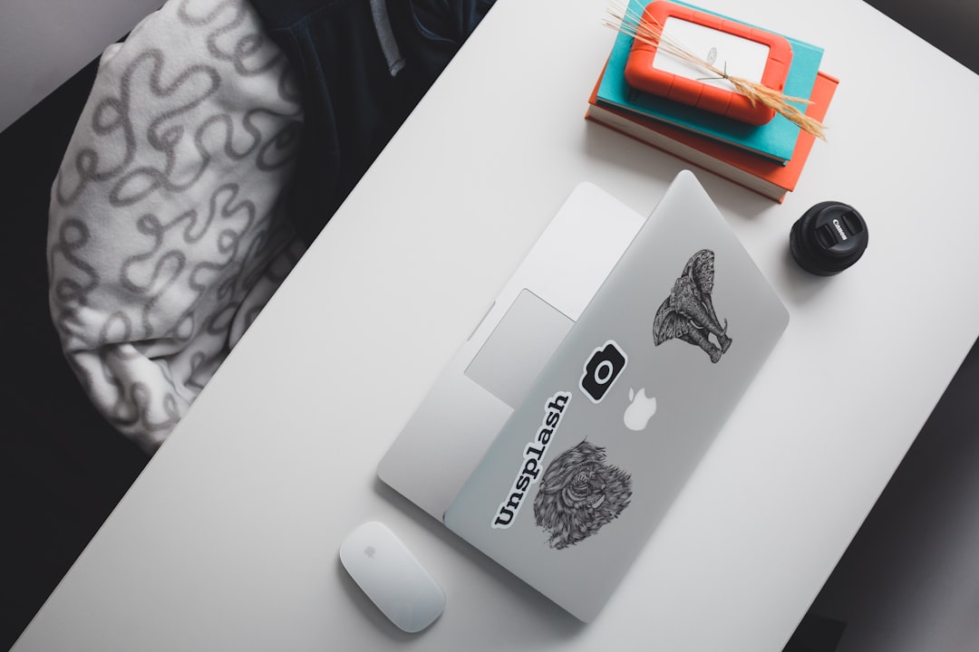 opened silver MacBook, work station