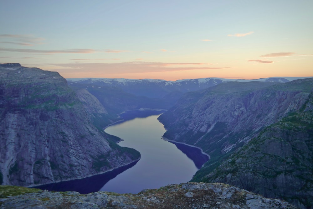 aerial view of lake between mountains