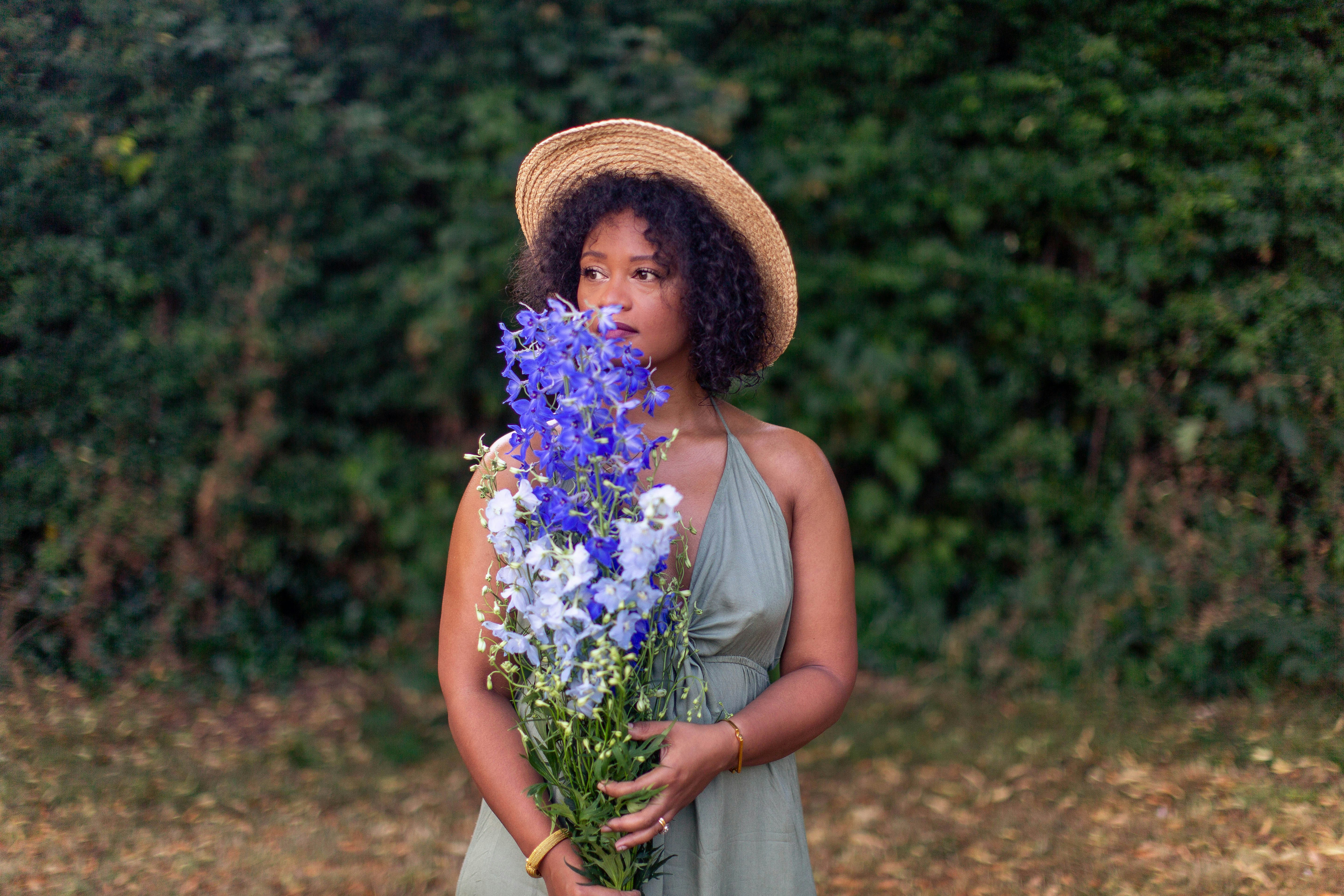 woman carrying flowers