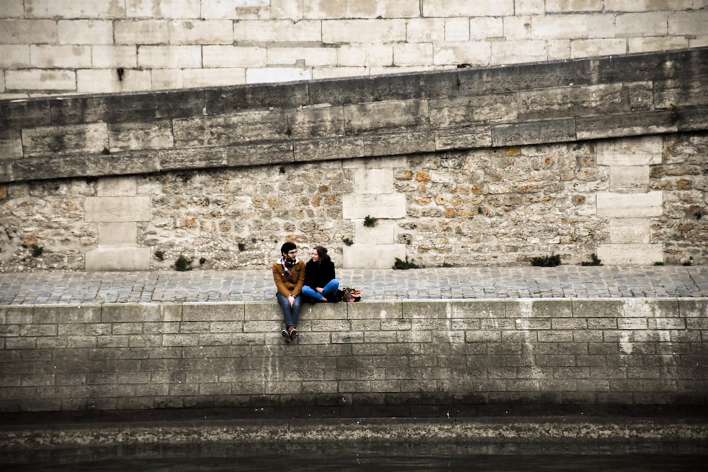 man and woman sitting together