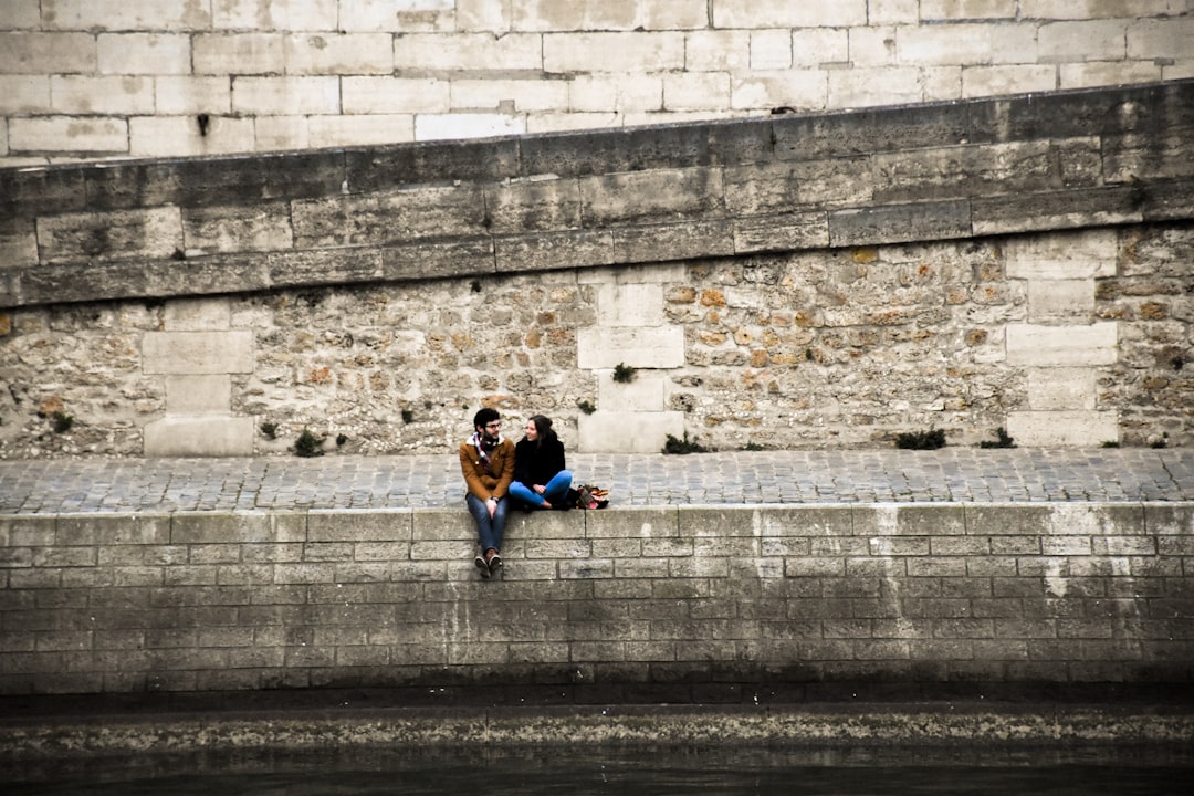 man and woman sitting together,