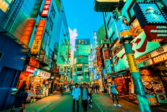 A vibrant street scene in Tokyo bustling with colorful signs and lively crowds.