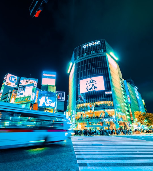 time-lapse photography of people crossing street during nighttime in Shibuya Japan