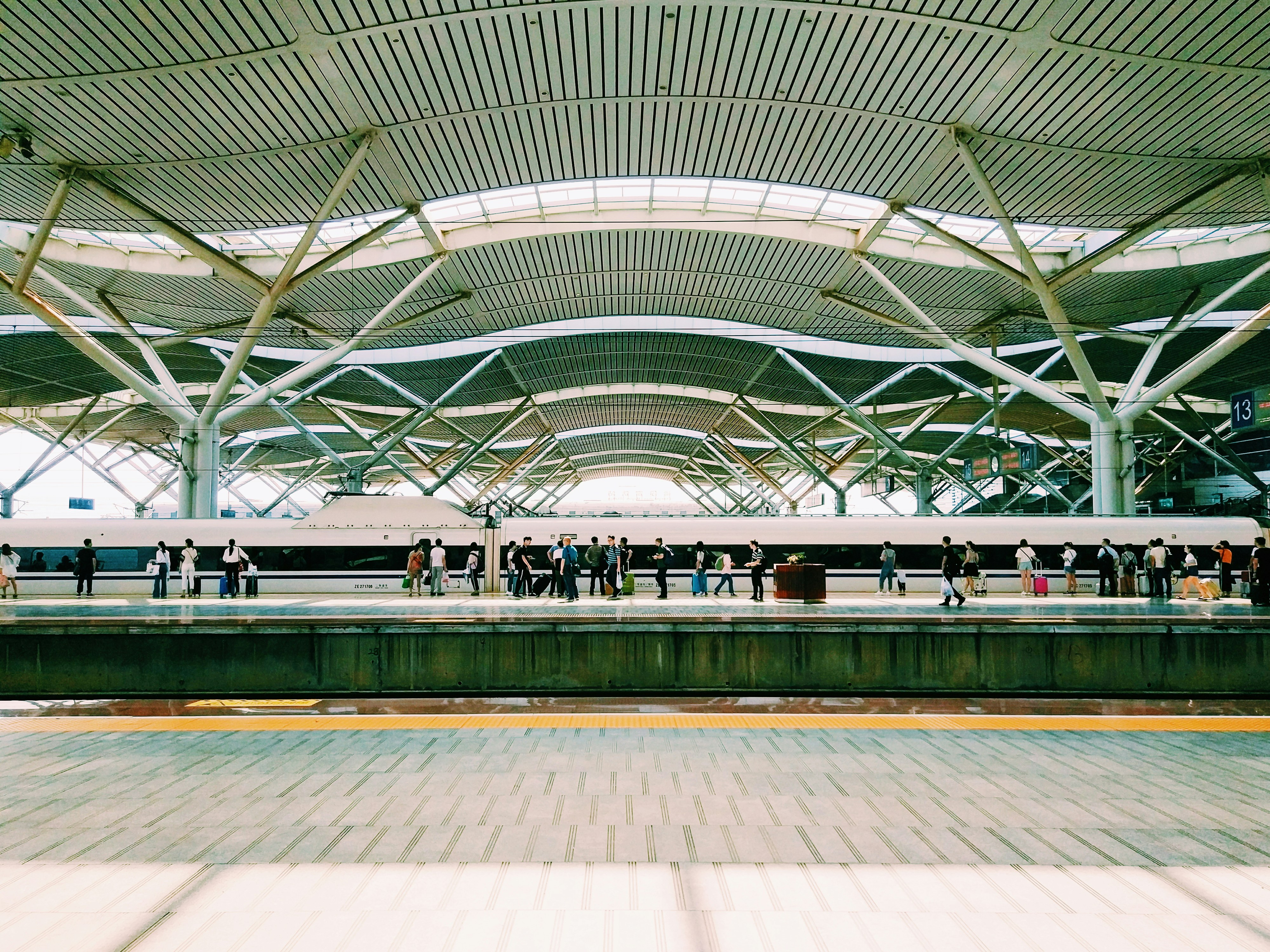 group of people on subway station, waiting for the railway in changsha south railway station.
