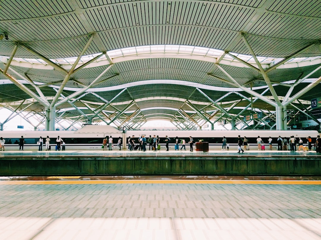 group of people on subway station, waiting for the railway in changsha south railway station.
