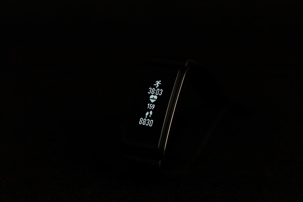 close-up photo of black fitness band powered on