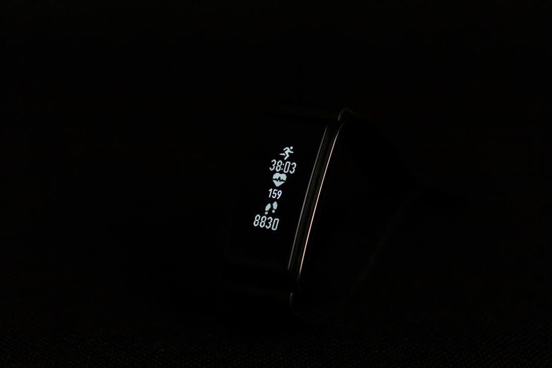 close-up photo of black fitness band powered on