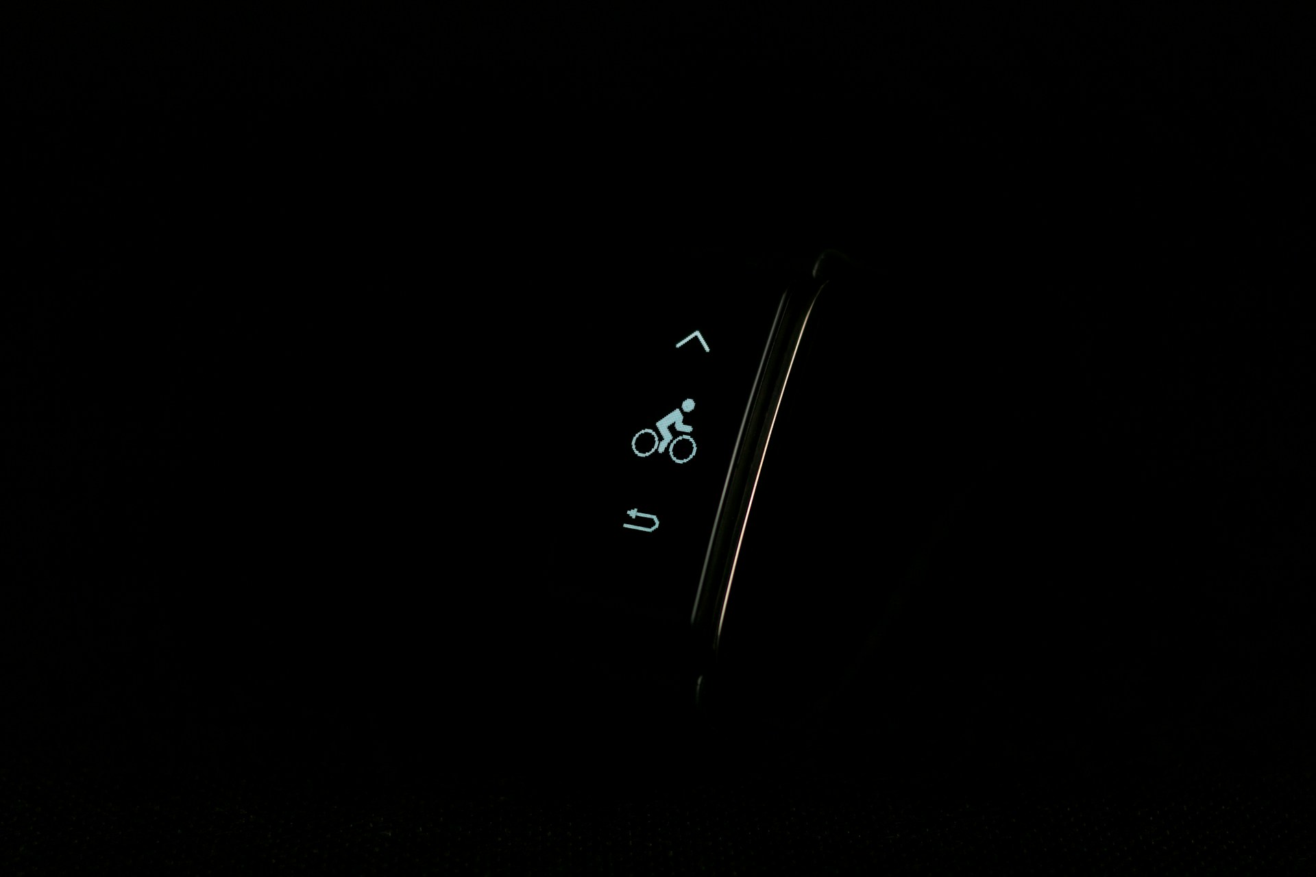 a close up of a cell phone in the dark