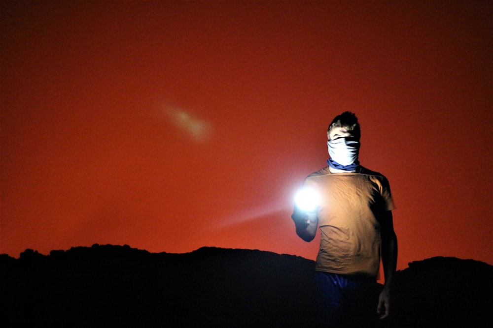 man holding flashlight