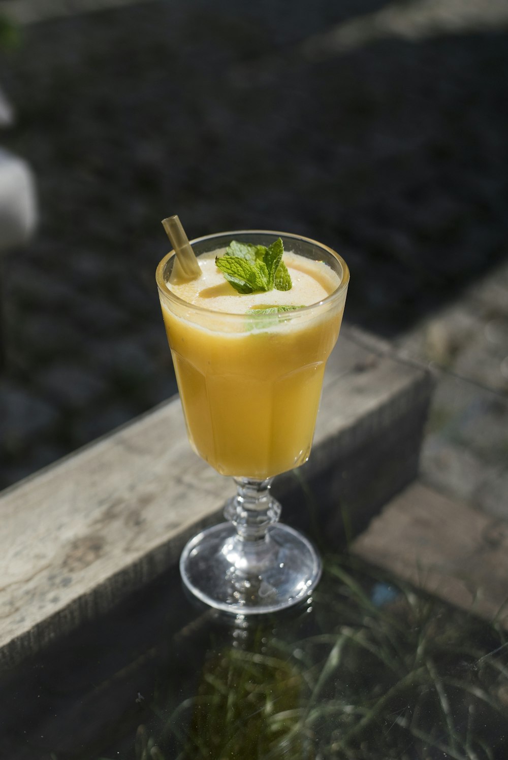 yellow liquid on clear drinking glass