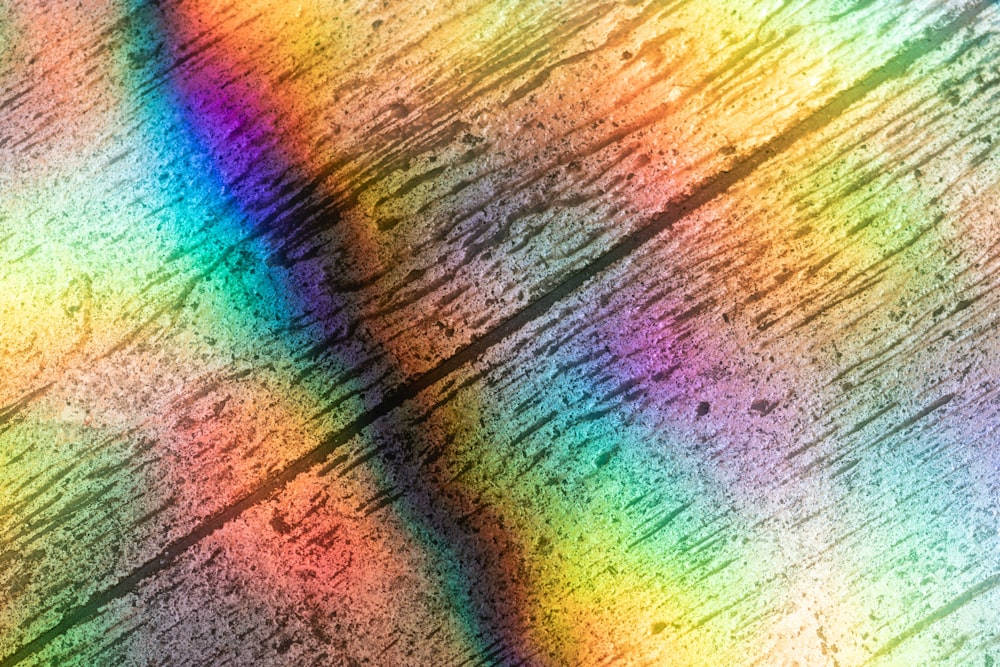 a multicolored image of a wooden surface