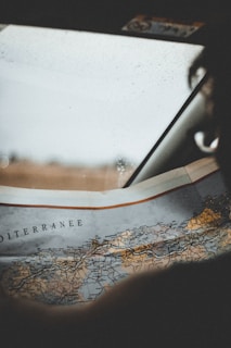 person taking photo of map
