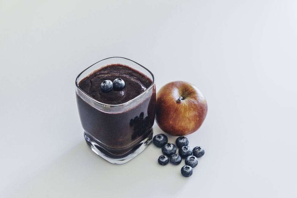 red apple on white surface