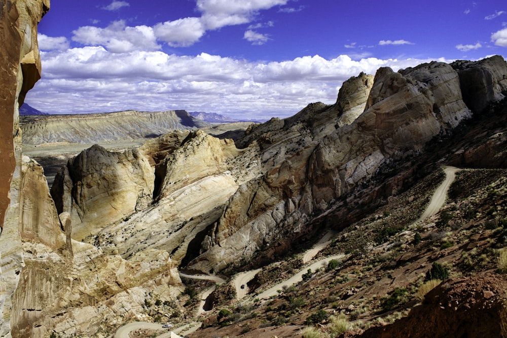 rocking mountain under blue and white sky