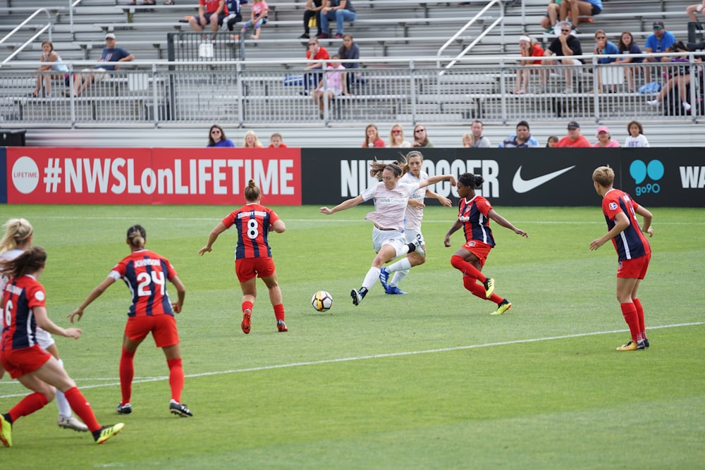 group of woman playing soccer game