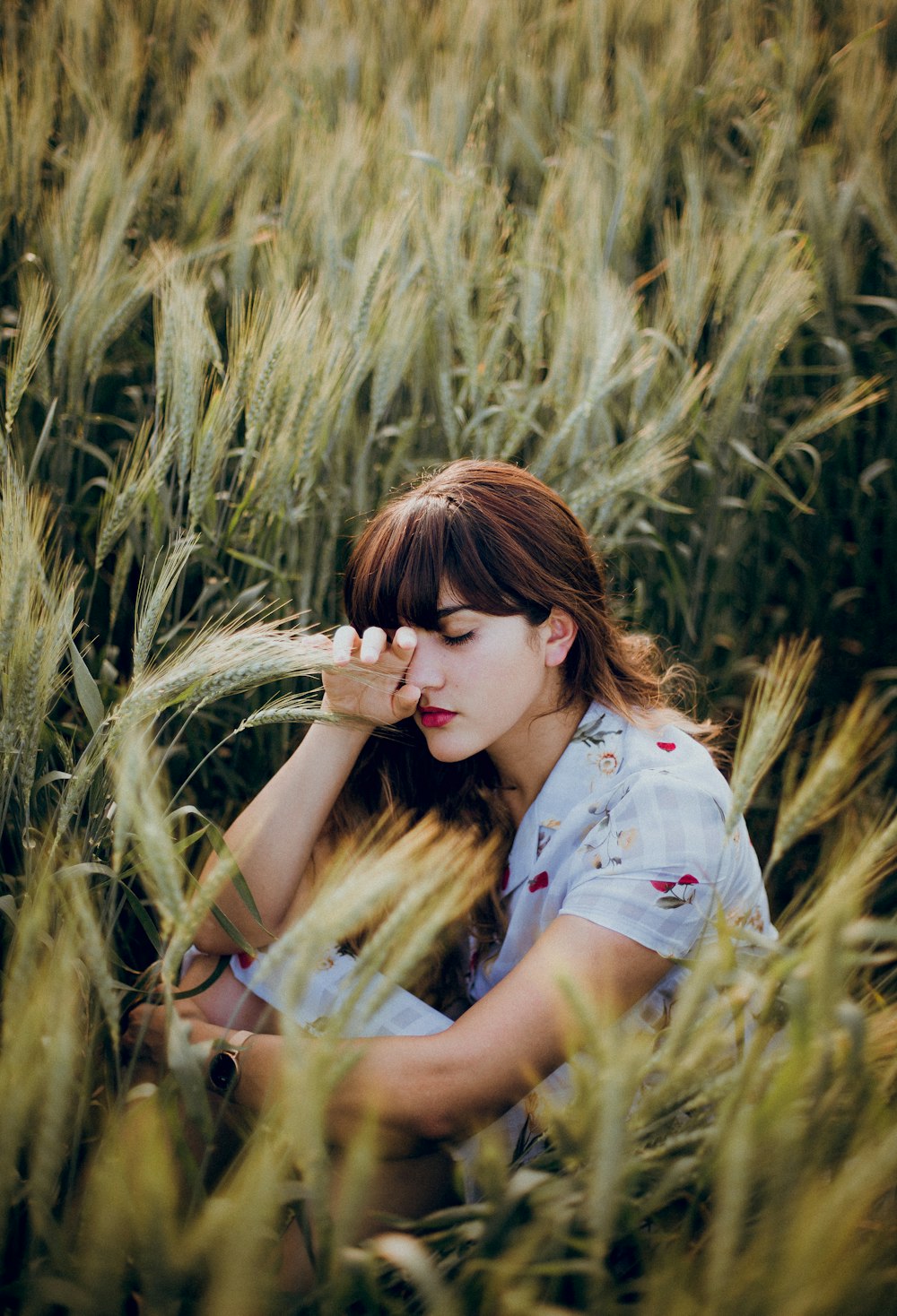 woman sitting on grass