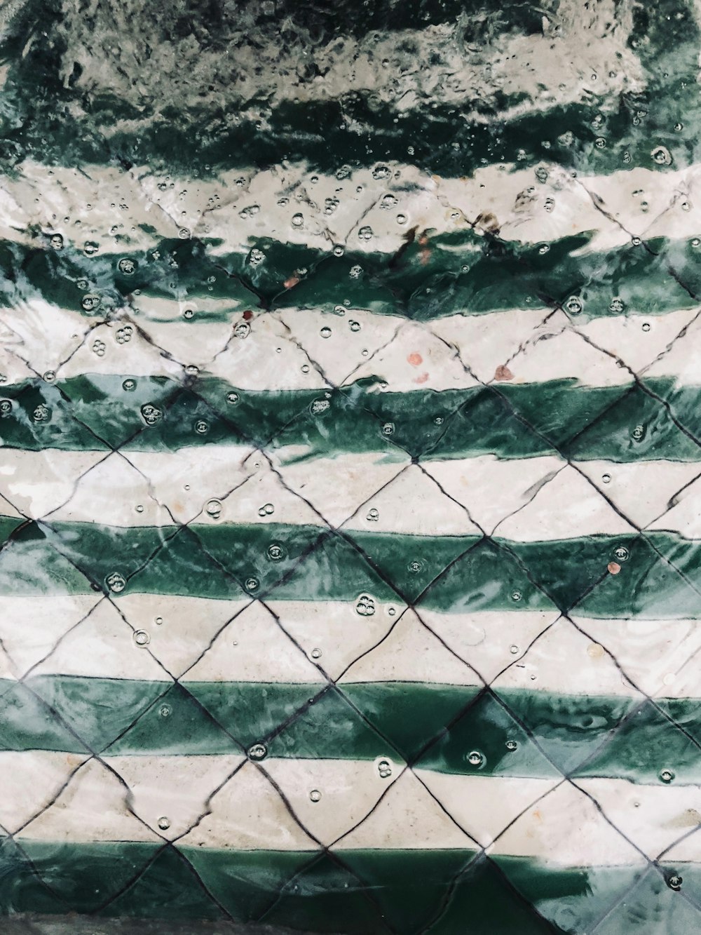 a painting of a green and white striped pattern