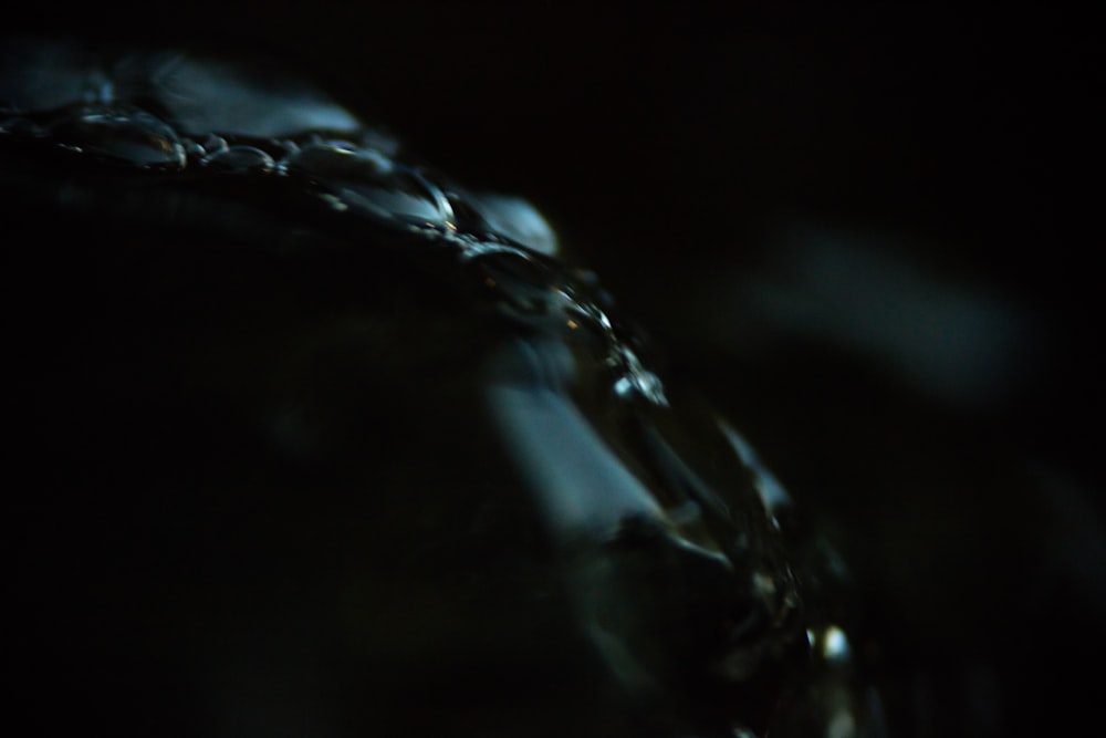 a close up shot of water being poured into a glass