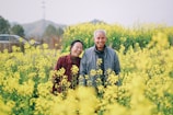 Smiling elderly couple enjoying a sunny day, symbolizing peace of mind.