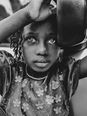 girl holding bowl on grayscale photography