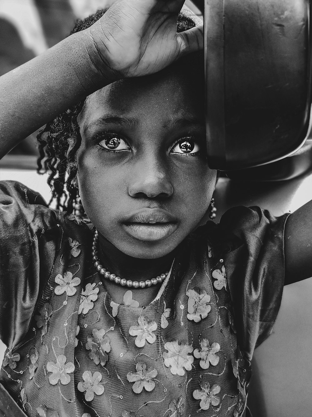 girl holding bowl on grayscale photography