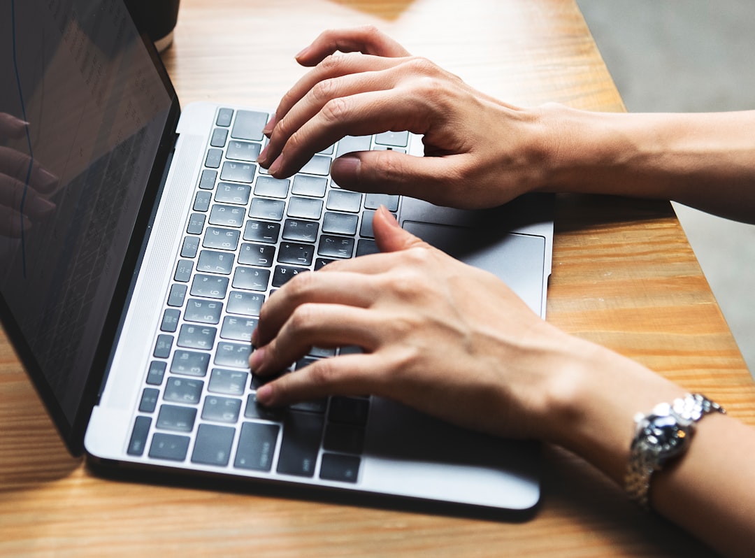 person using laptop computer