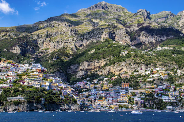 Positano's waterfront and steep hillside seen from the sea