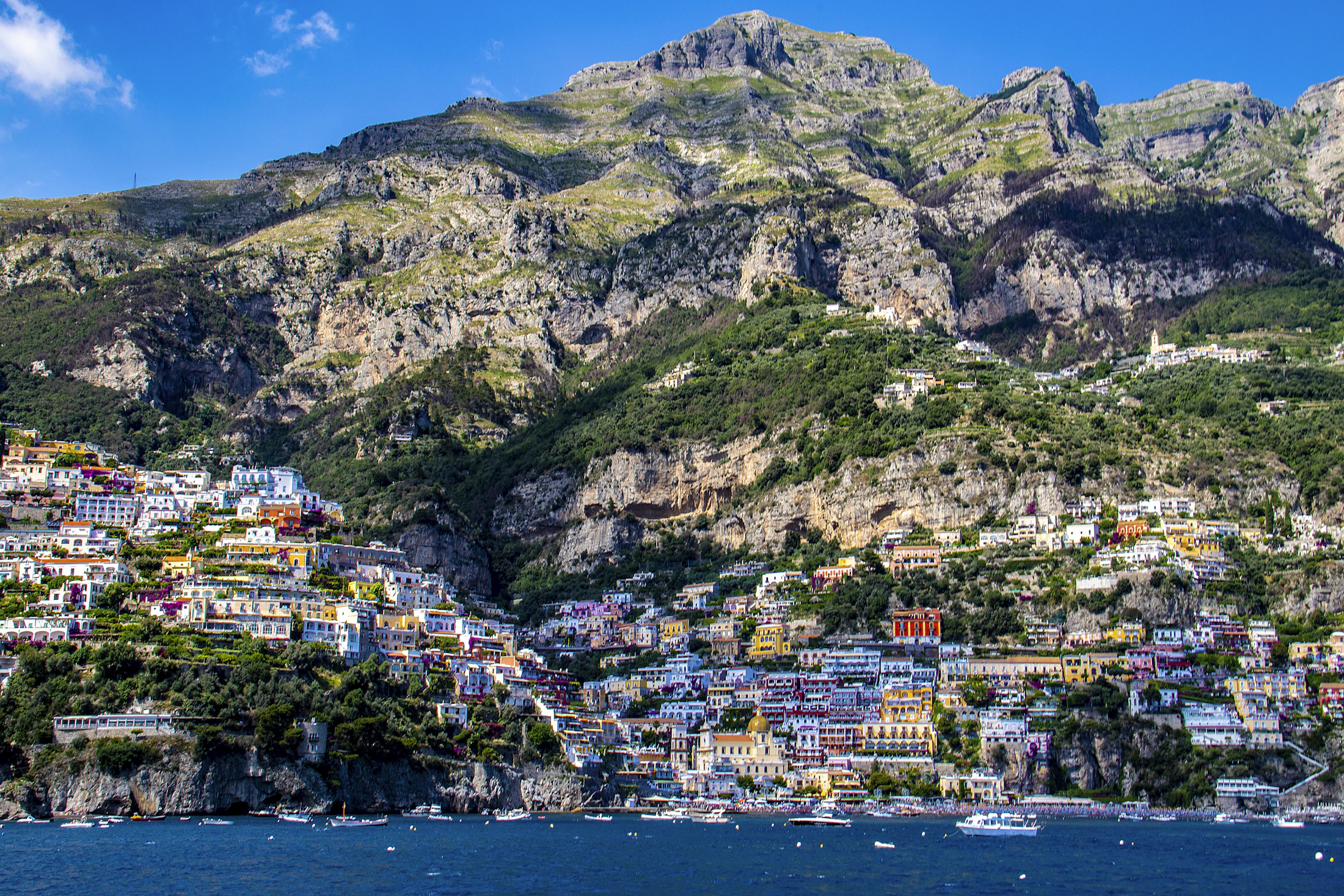Pastel houses of Positano stacked on the cliffs above the sea