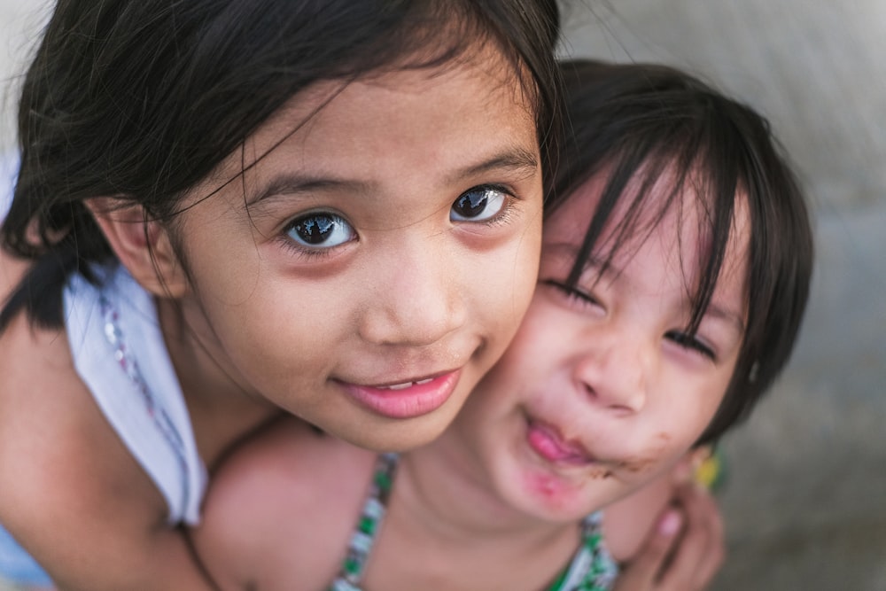 girl hugging girl from back