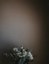 Lush faux flower arrangements in neutral tones, perfect for elegant event décor.