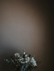 Lush faux flower arrangements in neutral tones, perfect for elegant event décor.