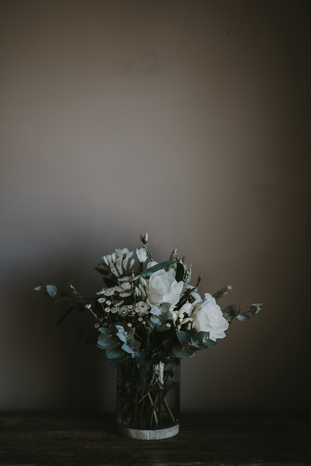 white petaled flower vase