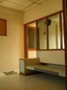 Clean tiled floor and simple furnishings in the room.