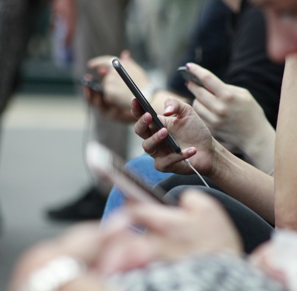 person holding black phone