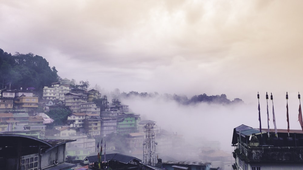 a view of a city with a foggy sky