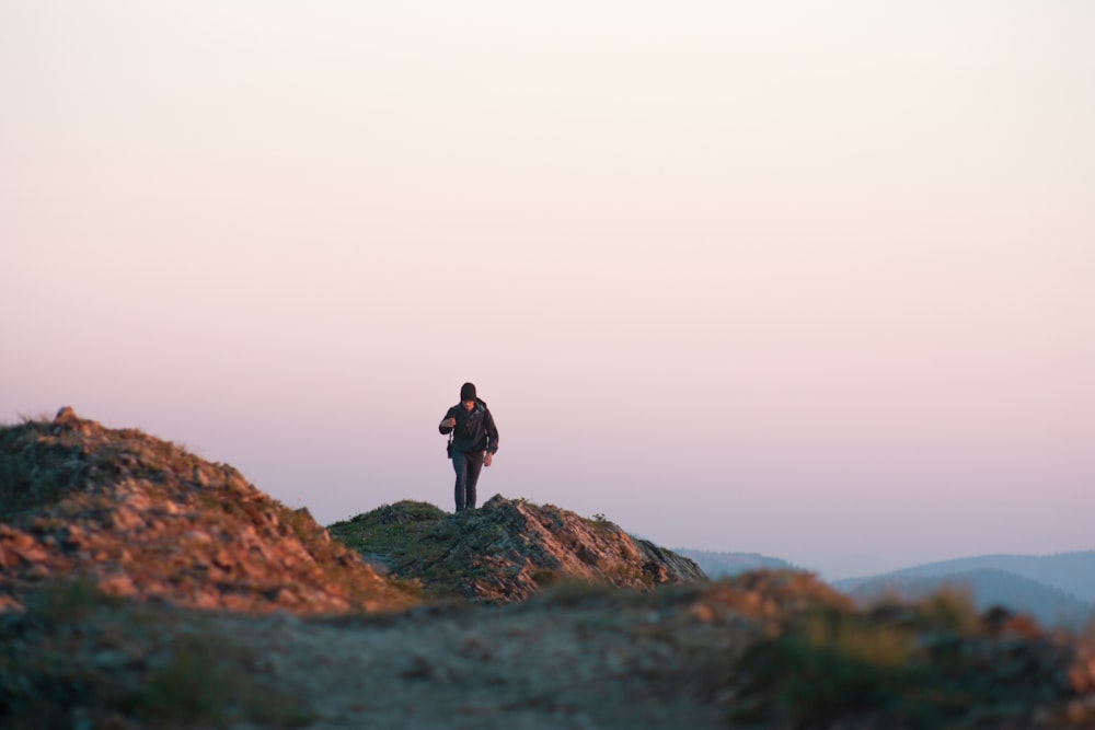 person walking on the dirt soil