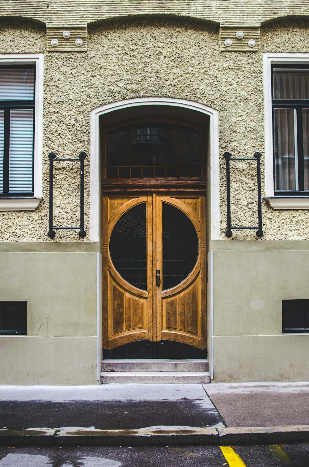 gray concrete building with closed door