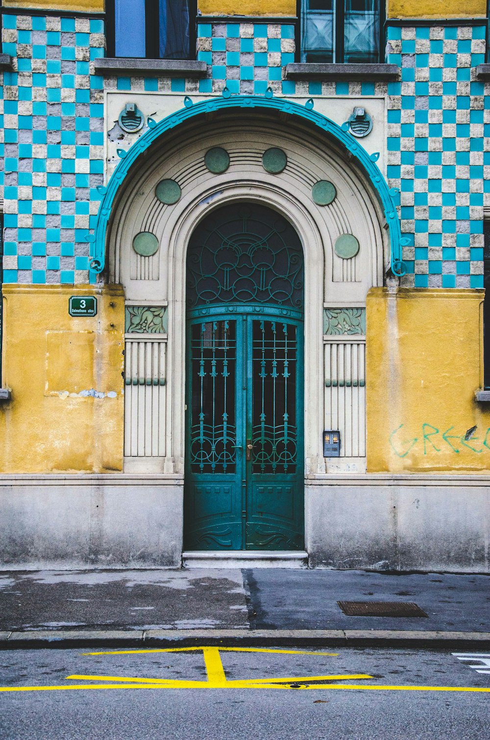 photography of empty street beside concrete house at daytime