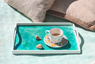 white ceramic mug on white serving tray