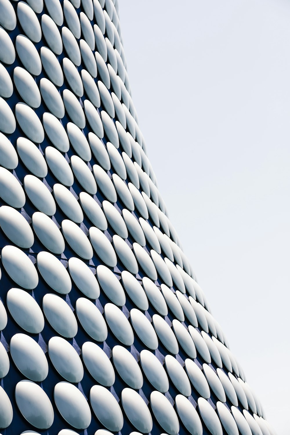 a close up of a building with a lot of white circles on it