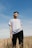man standing on brown long leafed grass