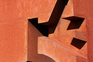 A laser-cut metal art piece featuring geometric patterns.