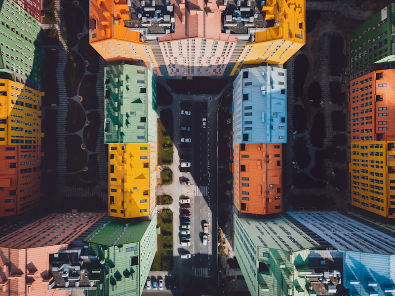 Aerial drone view of a building with a grid-like rooftop pattern, suited for mapping and surveying