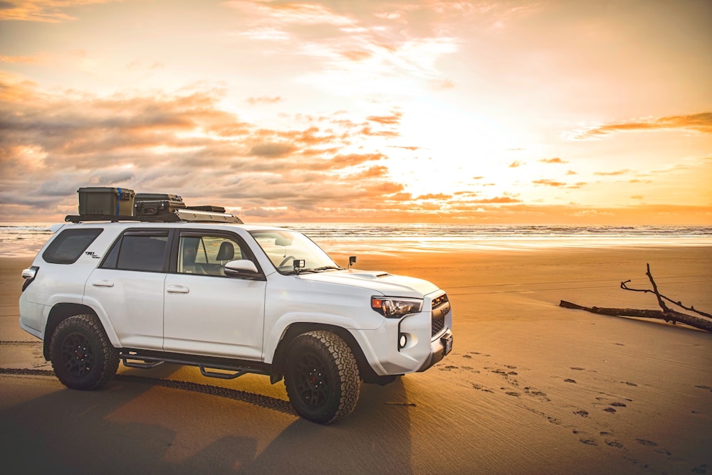 white SUV on beach